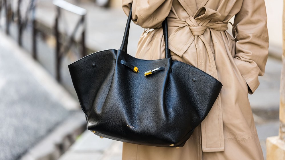 a demellier london tote bag being carried at fashion week